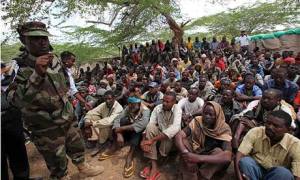 Al-Shabaab militants are paraded by Somalia government soldiers after their surrender to African Union and Somalia government soldiers in the north of Mogadishu. Photograph: Omar Faruk/Reuters